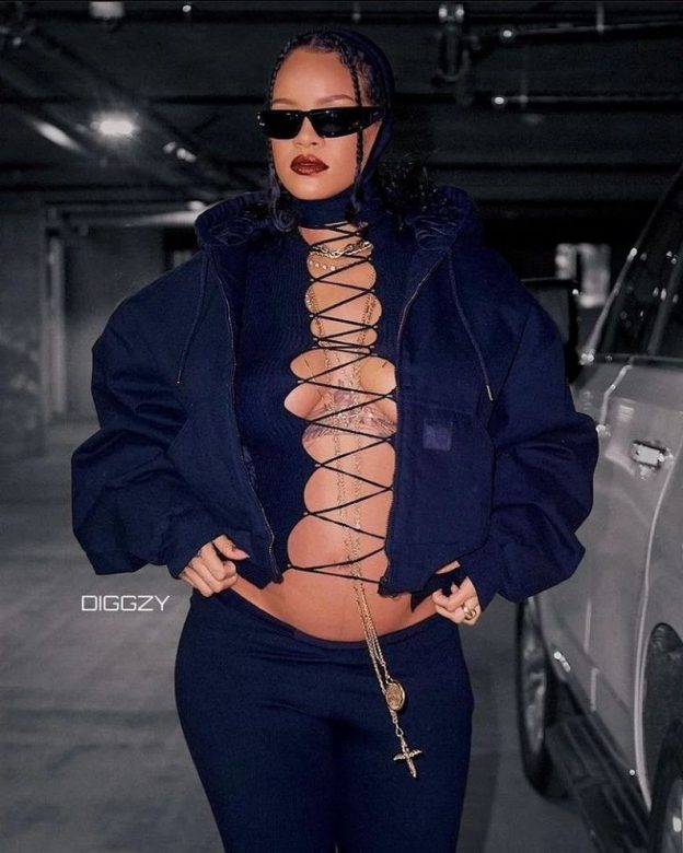 Rihanna Flaunts Her Baby Bump In Laced-Up Top