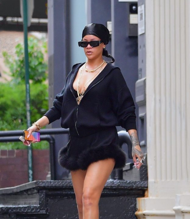 Rihanna In A Hoodie Dress Exposing Her Sexy Legs And Tits