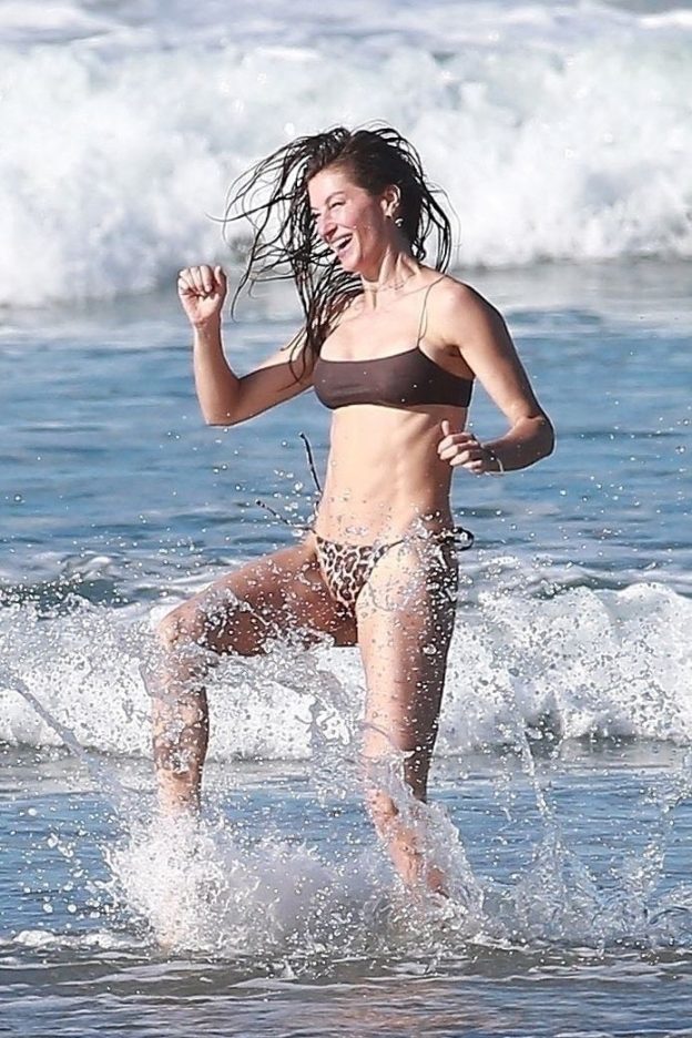 Gisele Bundchen Has Fun On The Beach In A Revealing Bikini (24 Photos)