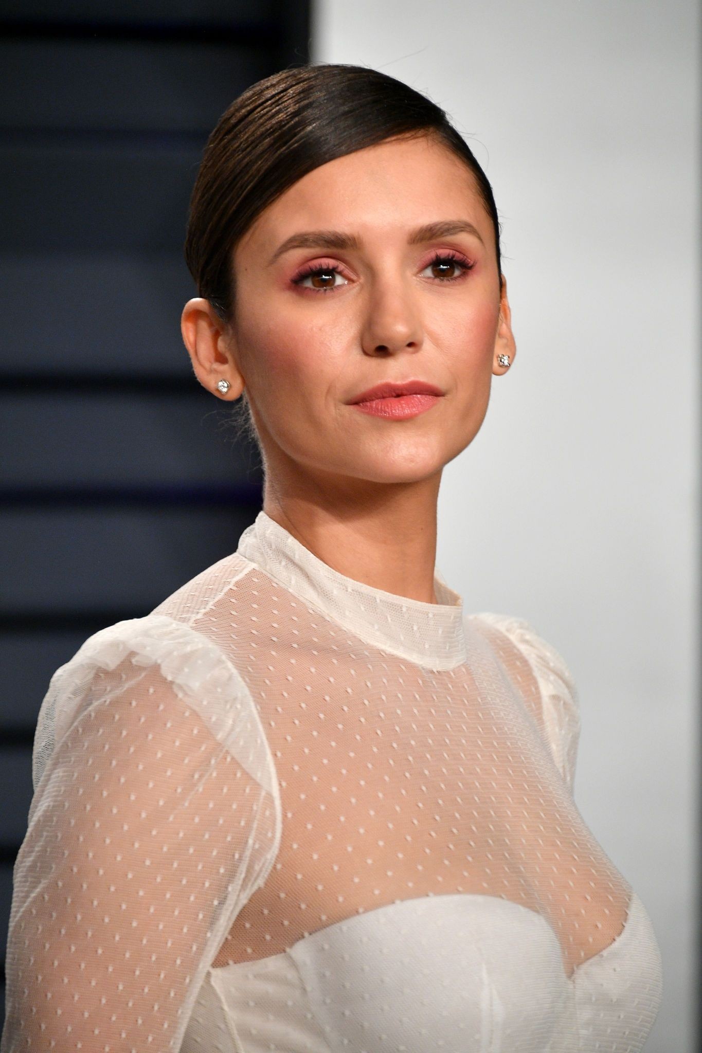 Nina Dobrev Sexy in White at Oscar Party